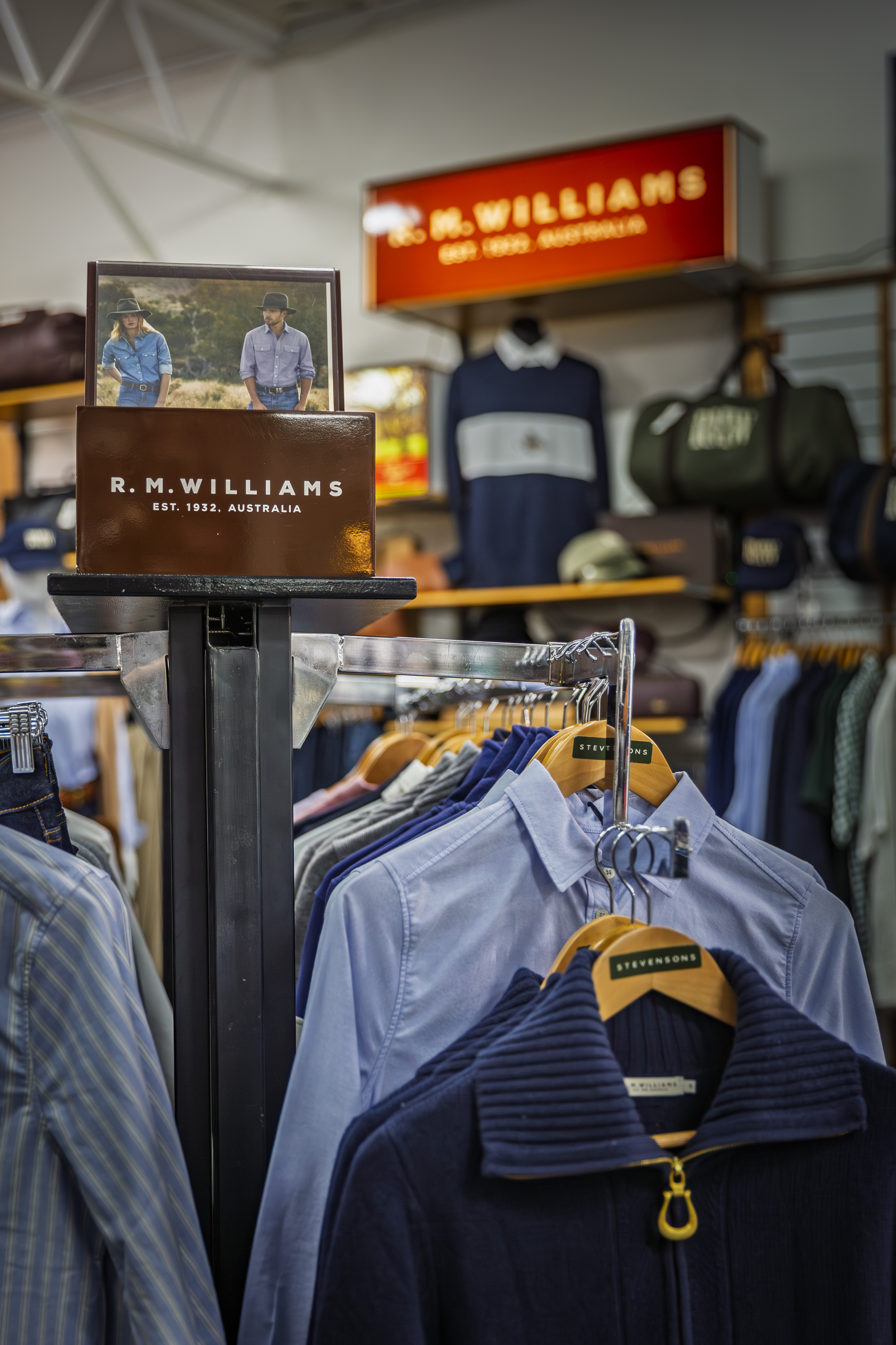 R.M. Williams display with shirts on branded Stevensons hangers.