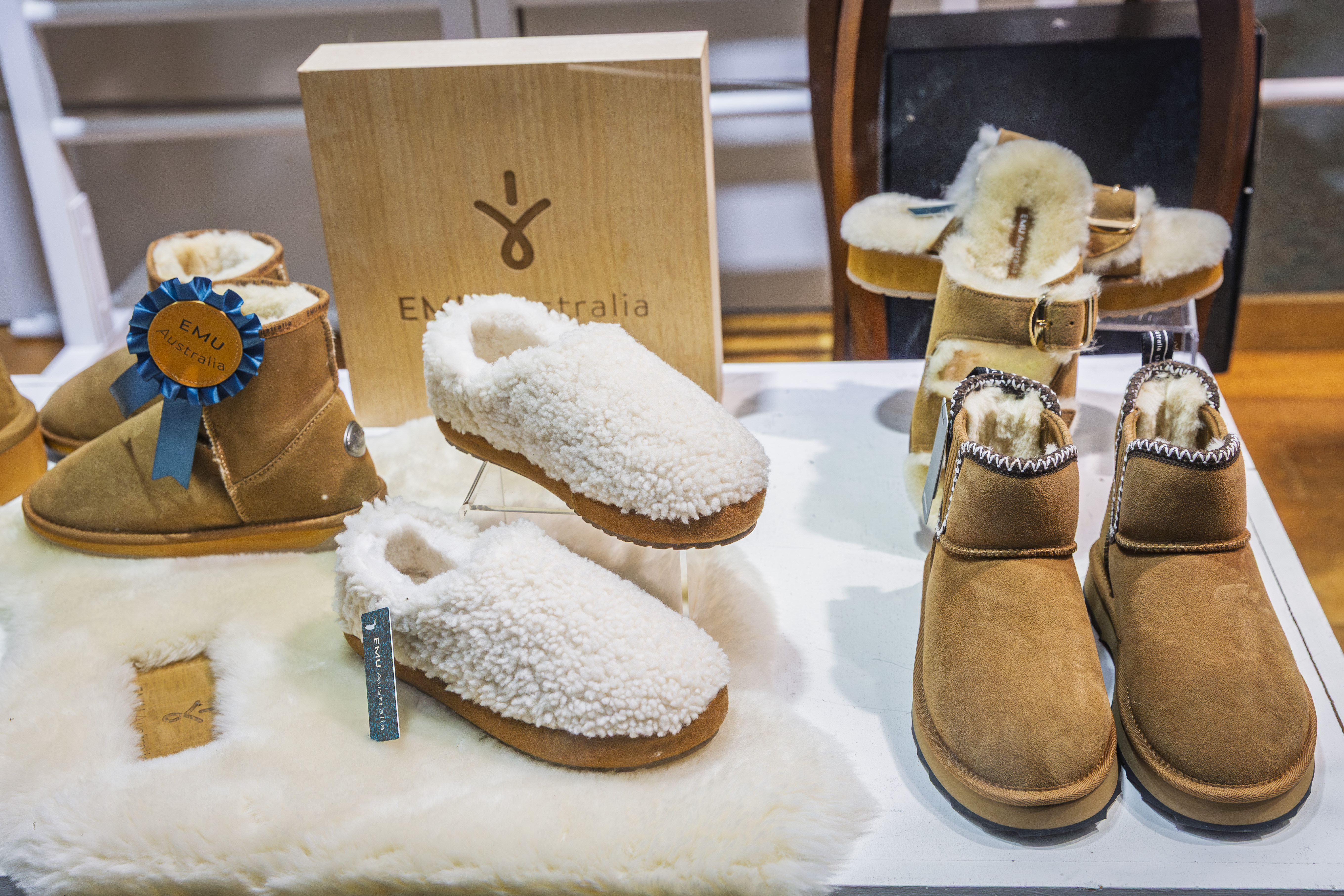 EMU Australia sheepskin boots and slippers on display.