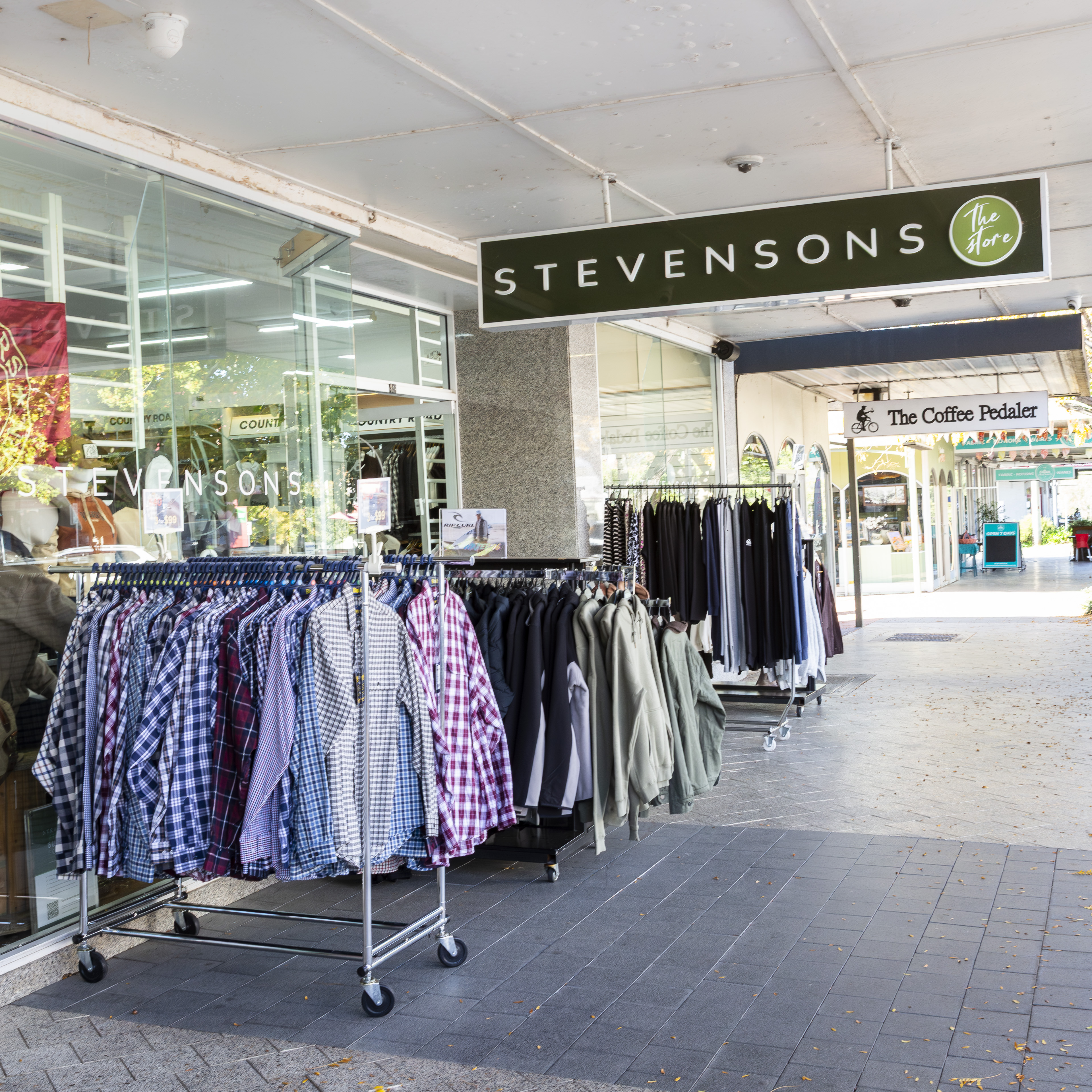 Clothing racks outside the Stevensons storefront on Wynyard Street, Tumut.