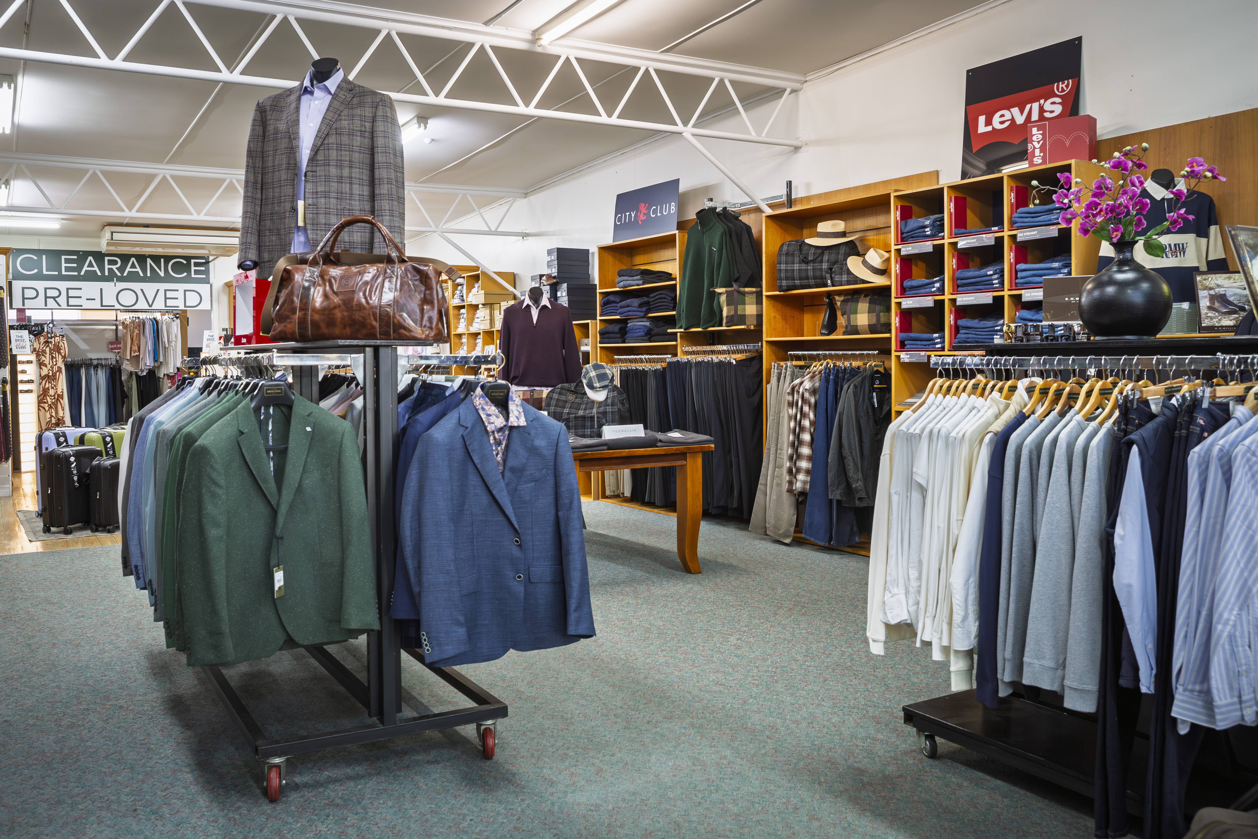 Menswear section with suits, jackets and Levi's display at Stevensons The Store.