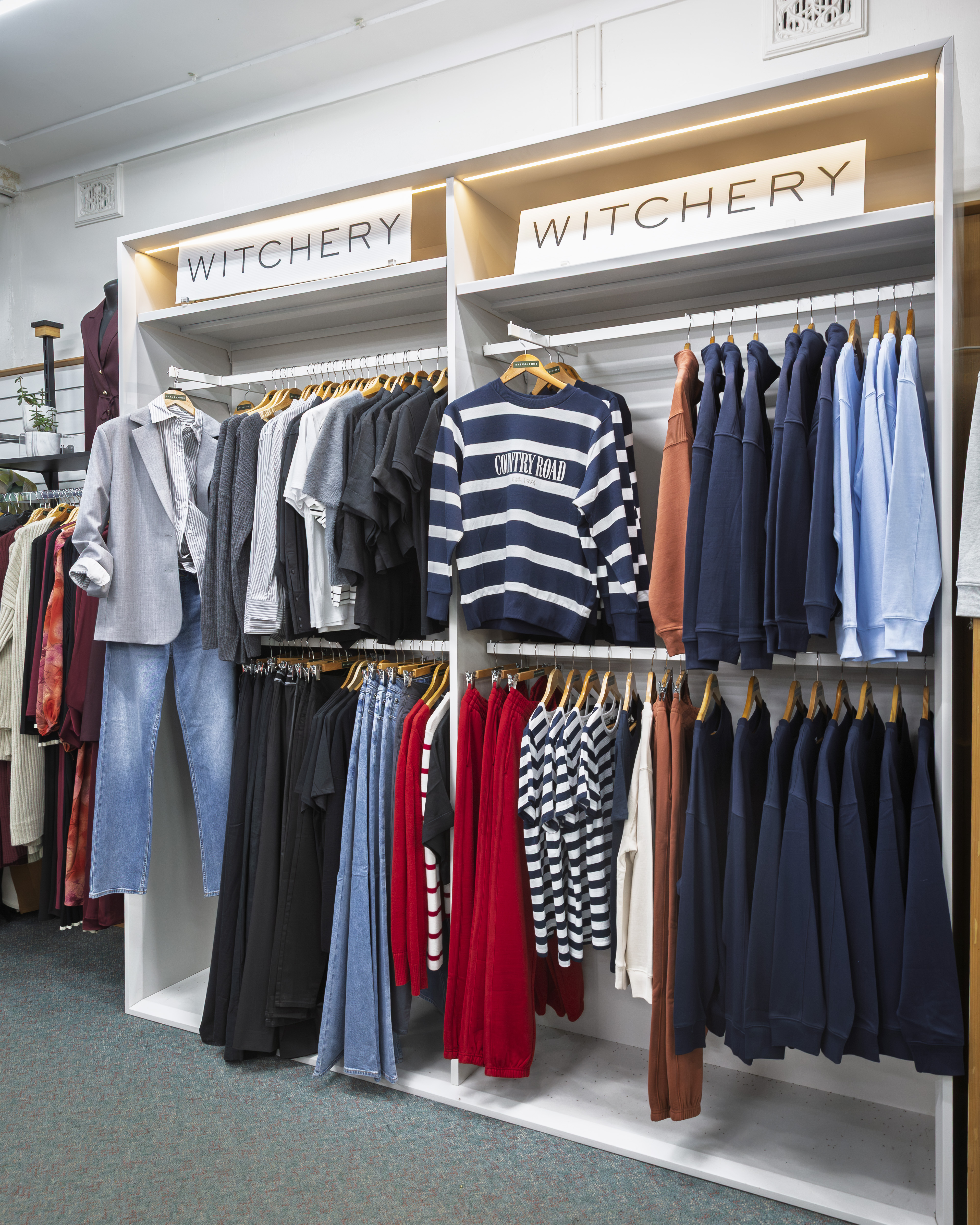 Witchery ladies clothing display with knitwear and Country Road striped jumper.