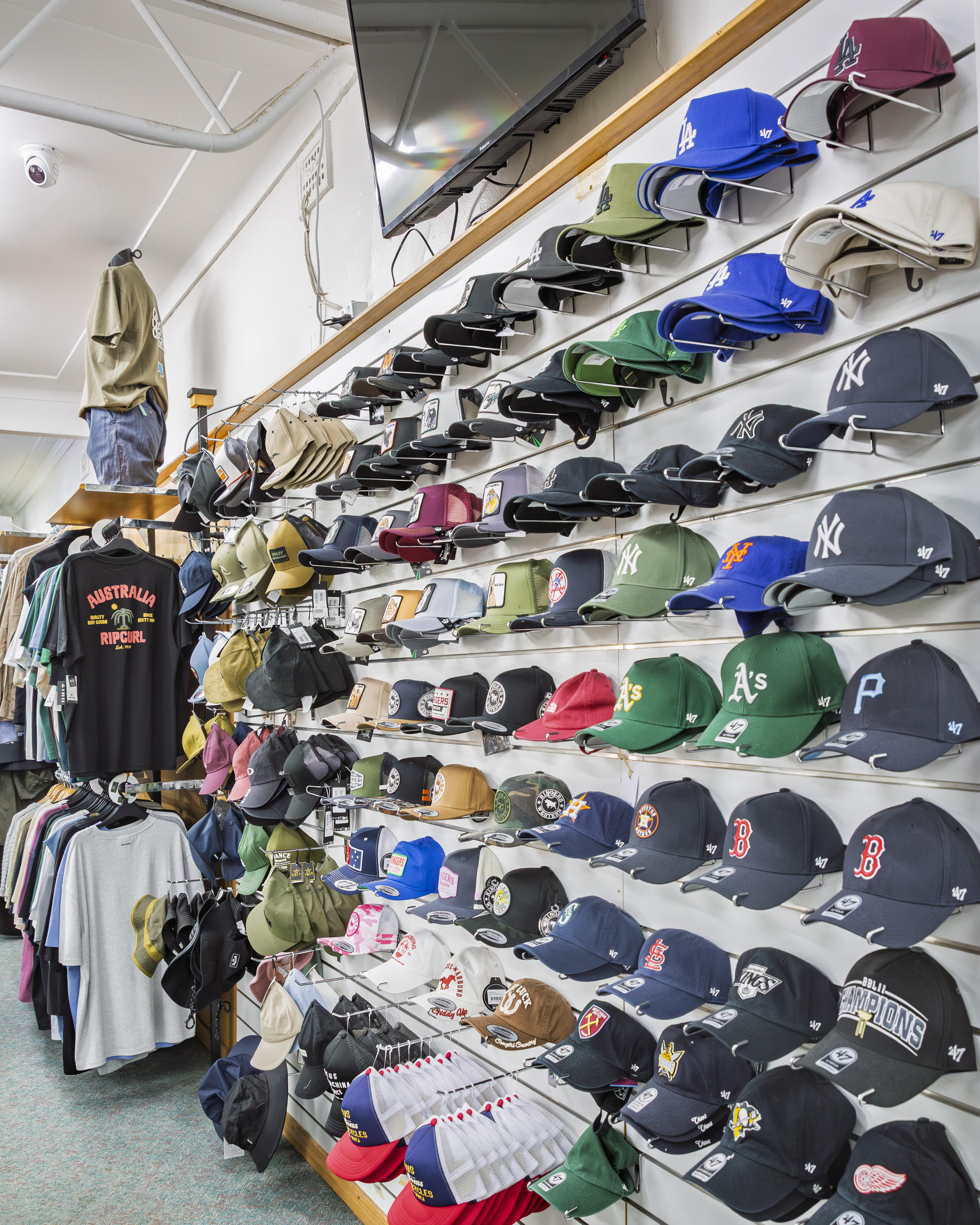 Full wall of caps and hats from MLB, Rip Curl, and more at Stevensons The Store.