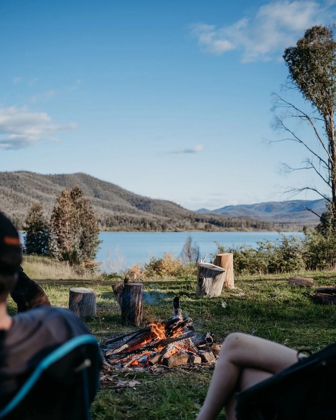 Campfire by the lake with mountain views near Tumut.