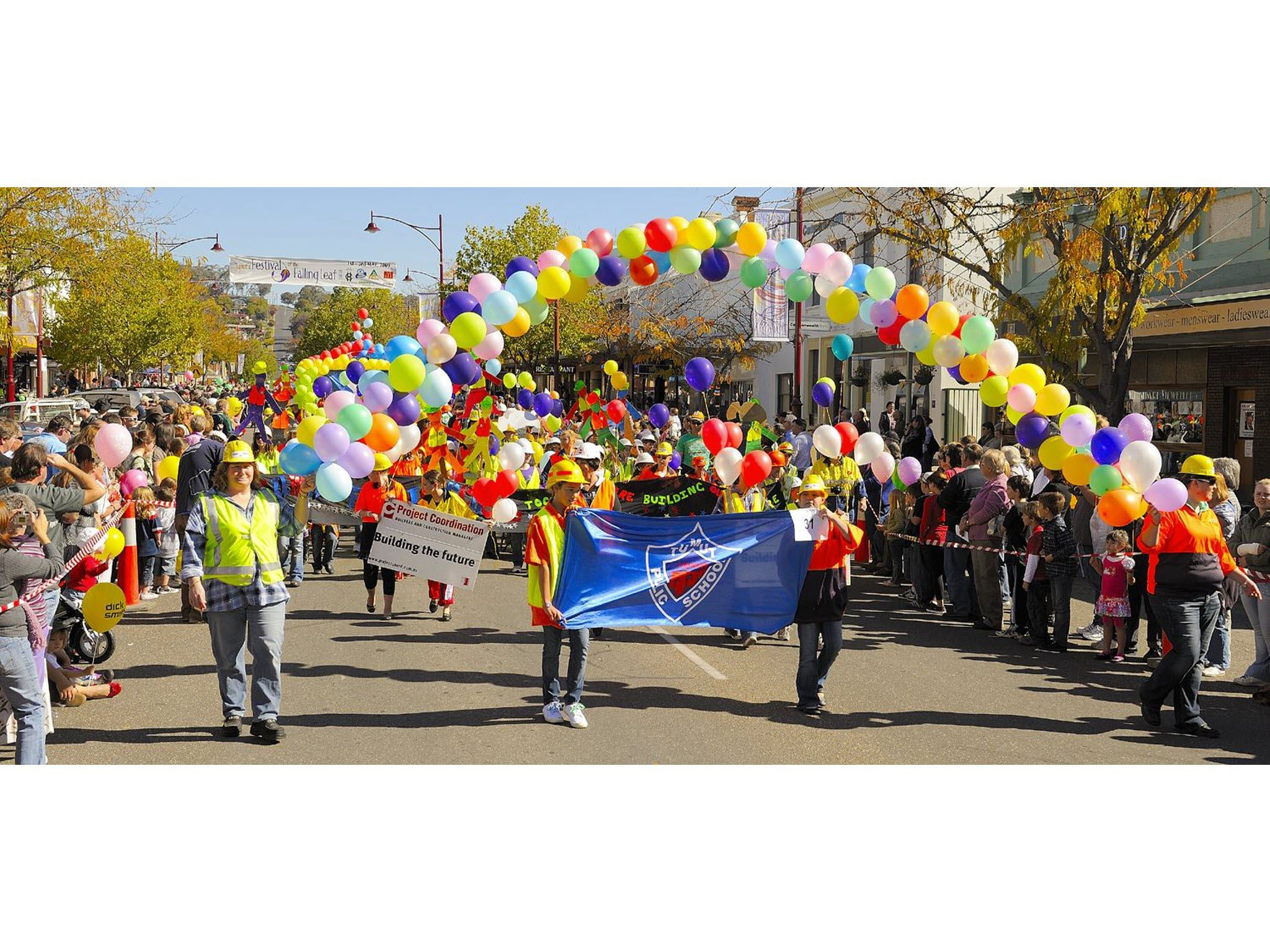 Street parade with colourful balloons at the Festival of the Falling Leaf.