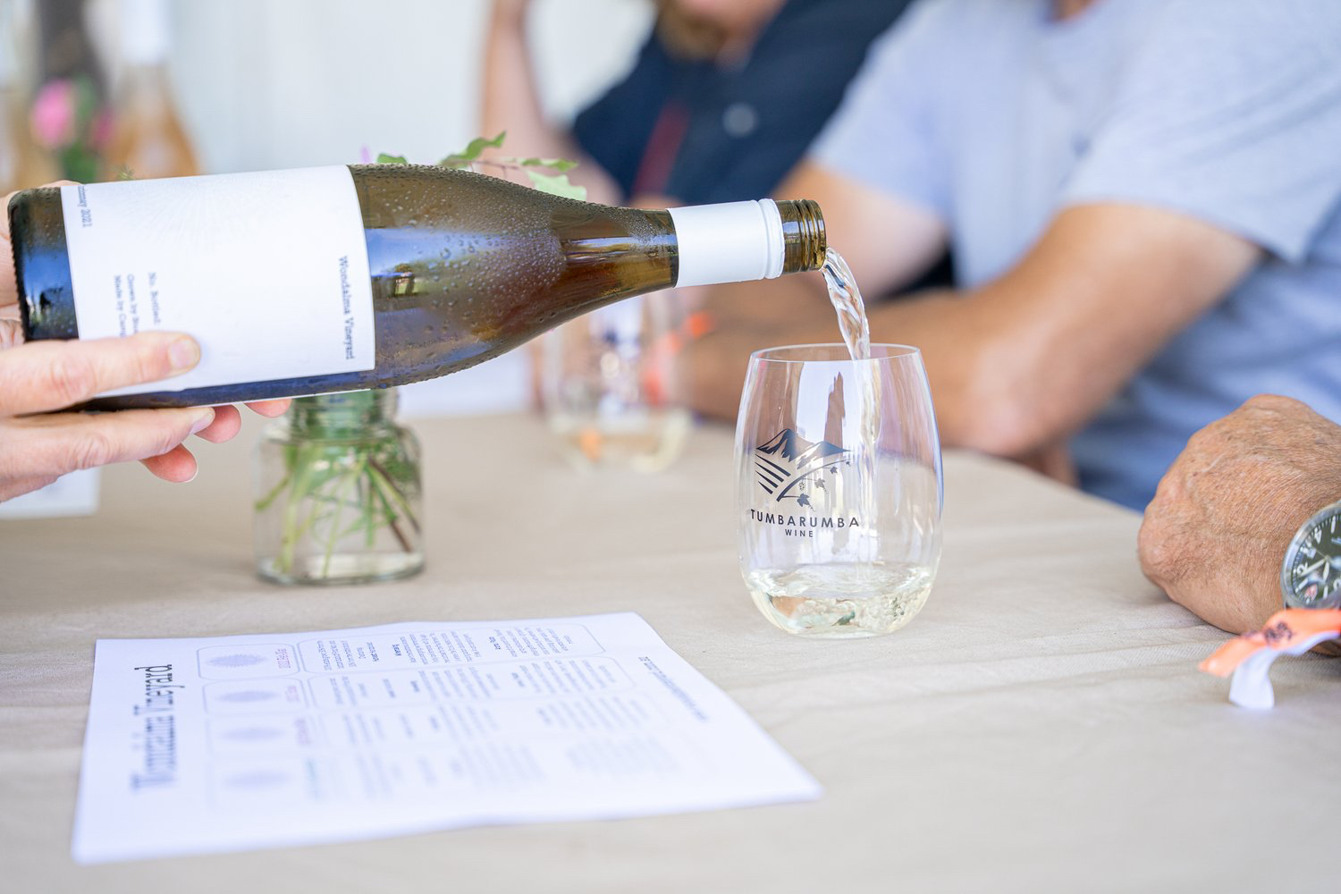 Tumbarumba wine being poured at a tasting.